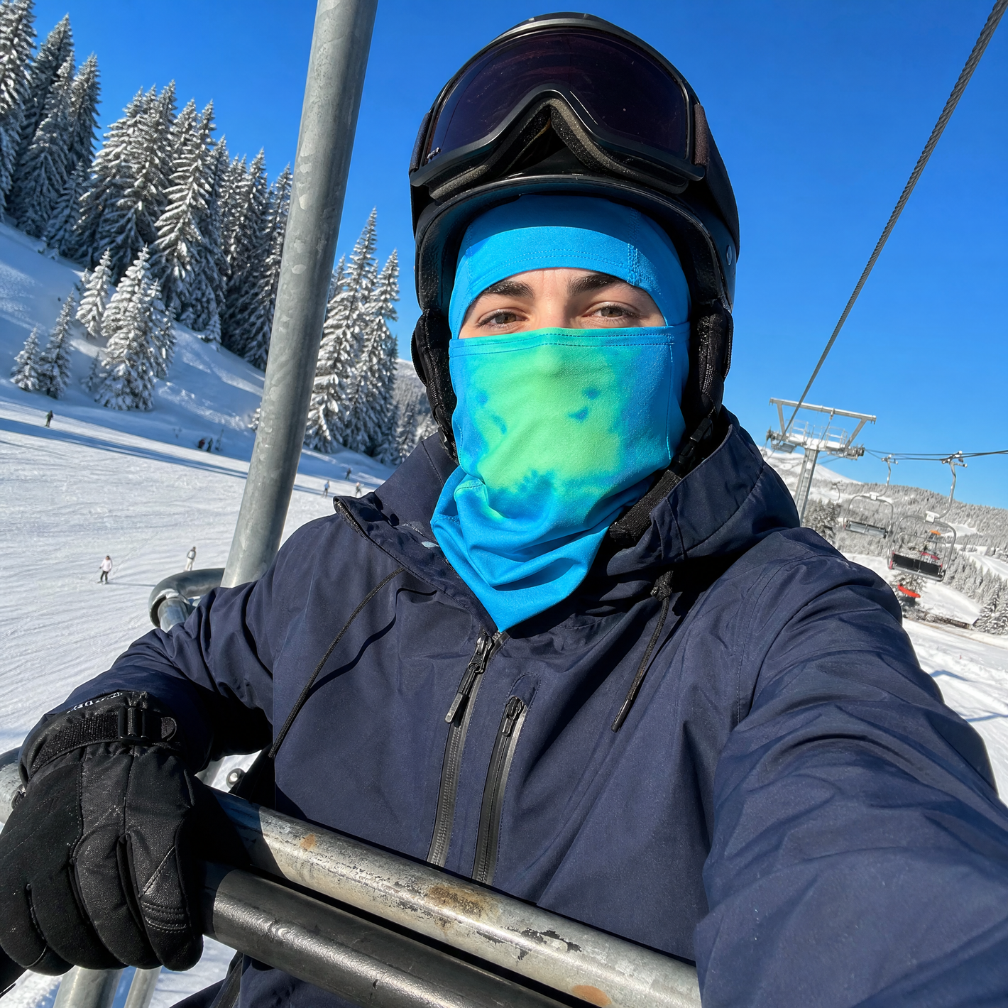Blue and green mask styled outdoors